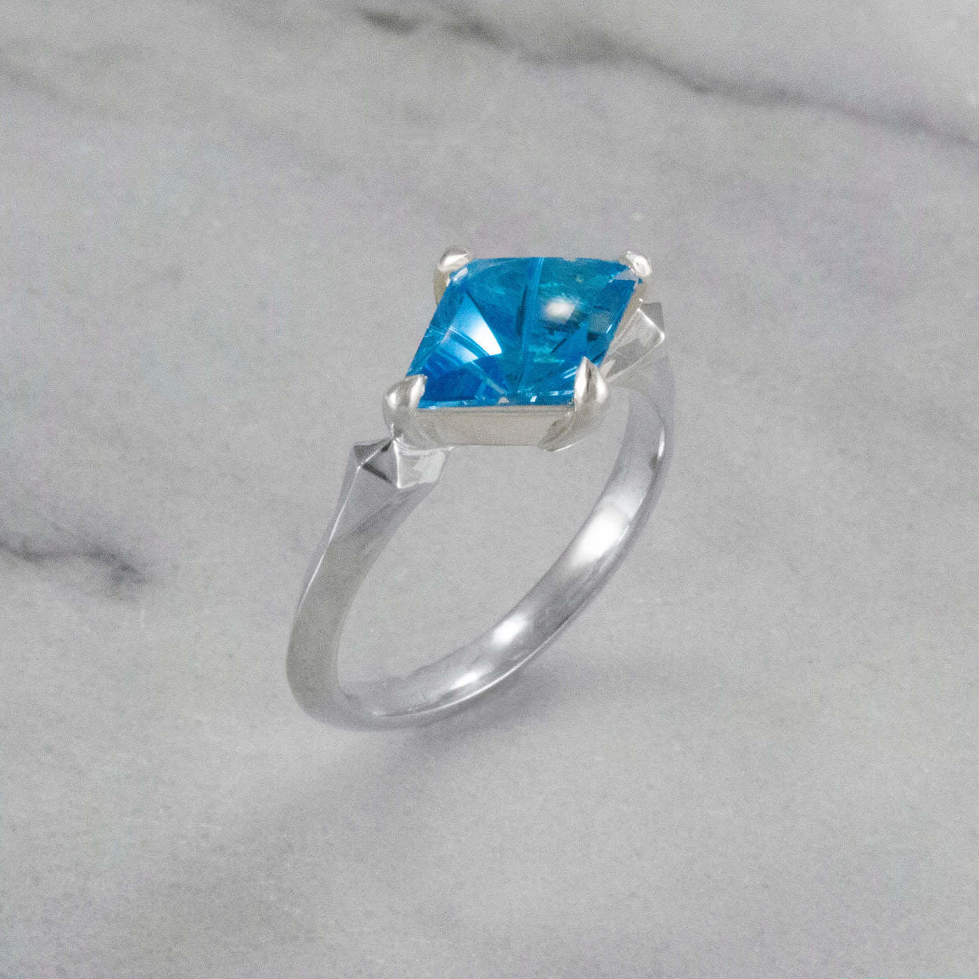 Kite Shaped Blue Topaz Pyramid Ring angled view