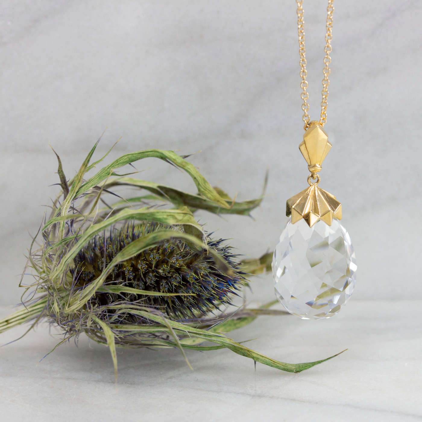 Pyramid Capped Rock Quartz Briolette Pendant with thistle