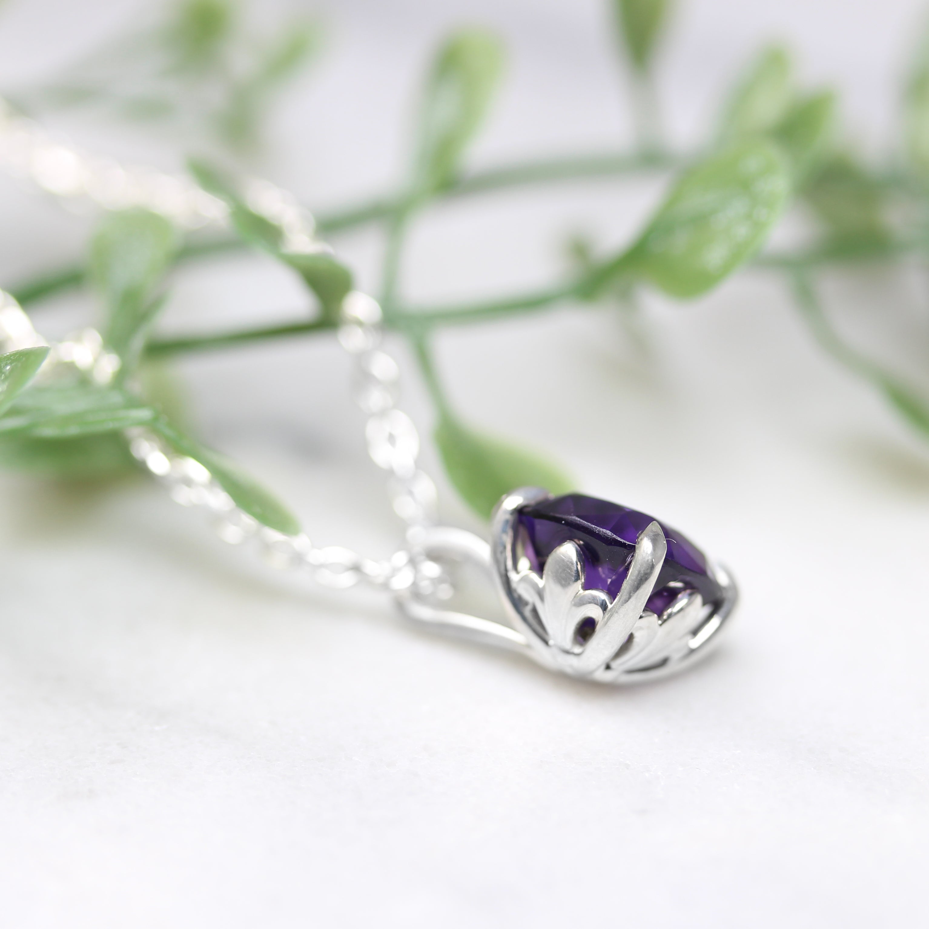 amethyst silver pendant back angled view with greenery