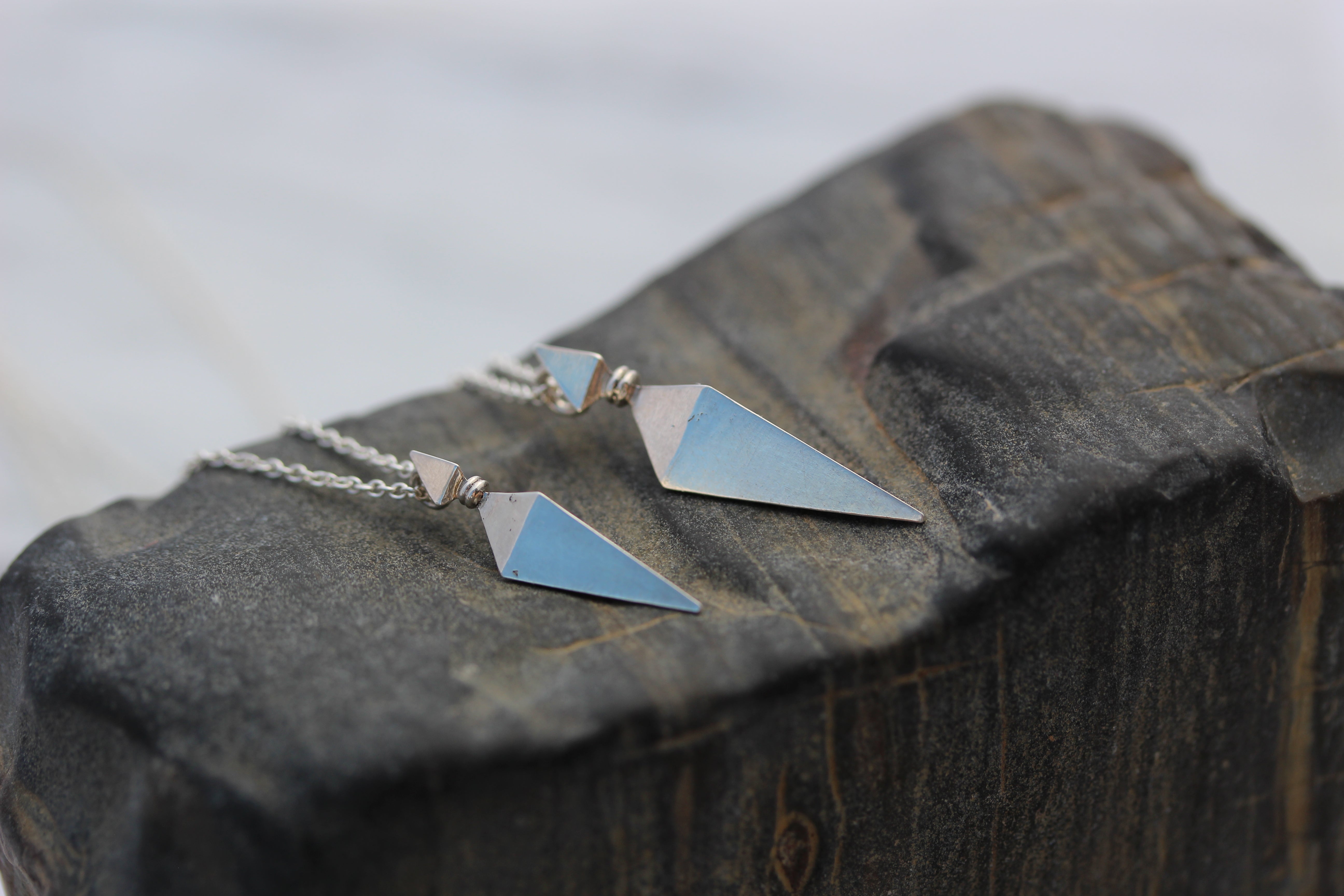 lovo jewelry silver pyramid spike pendants on petrified wood