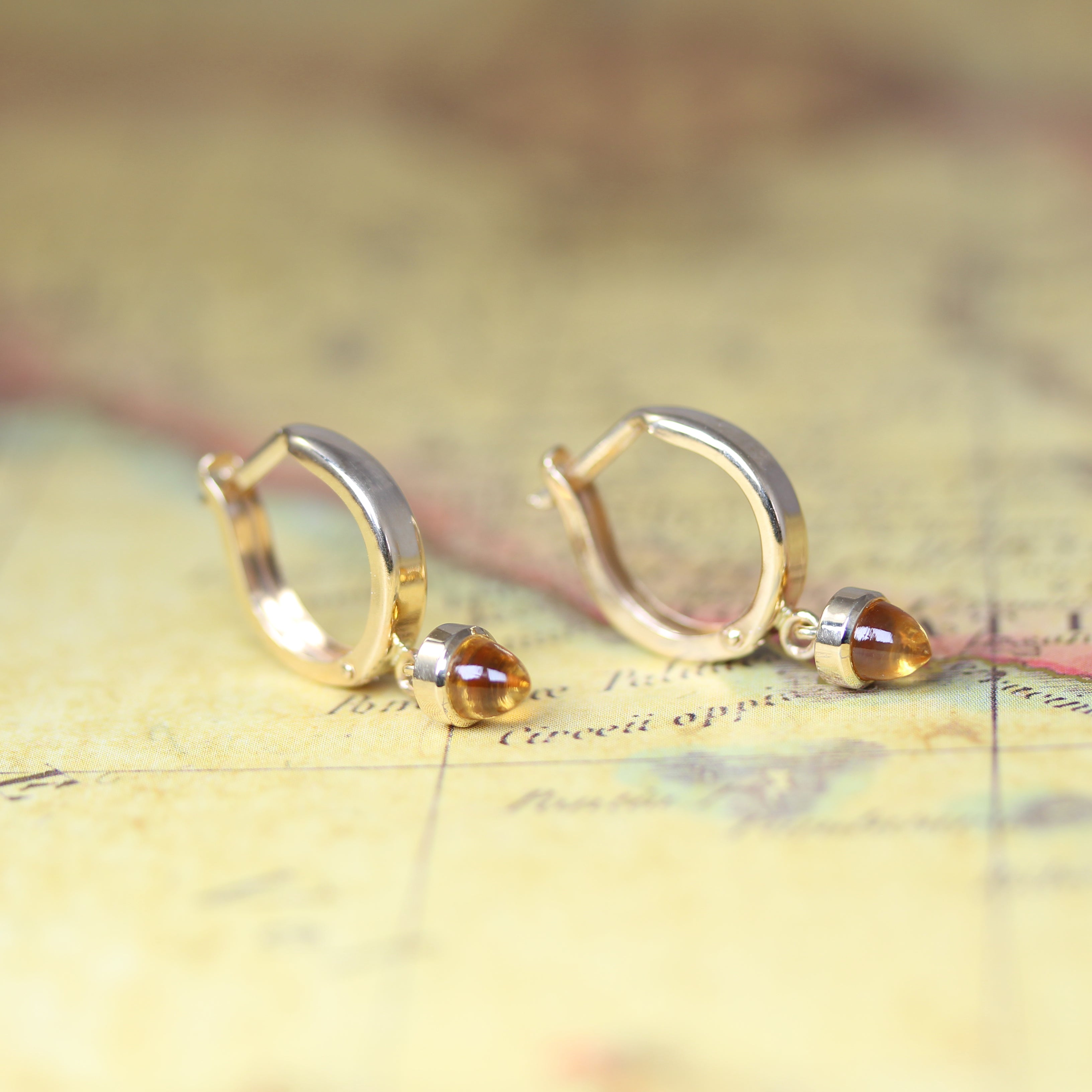 citrine bullet and yellow gold earrings on vintage map