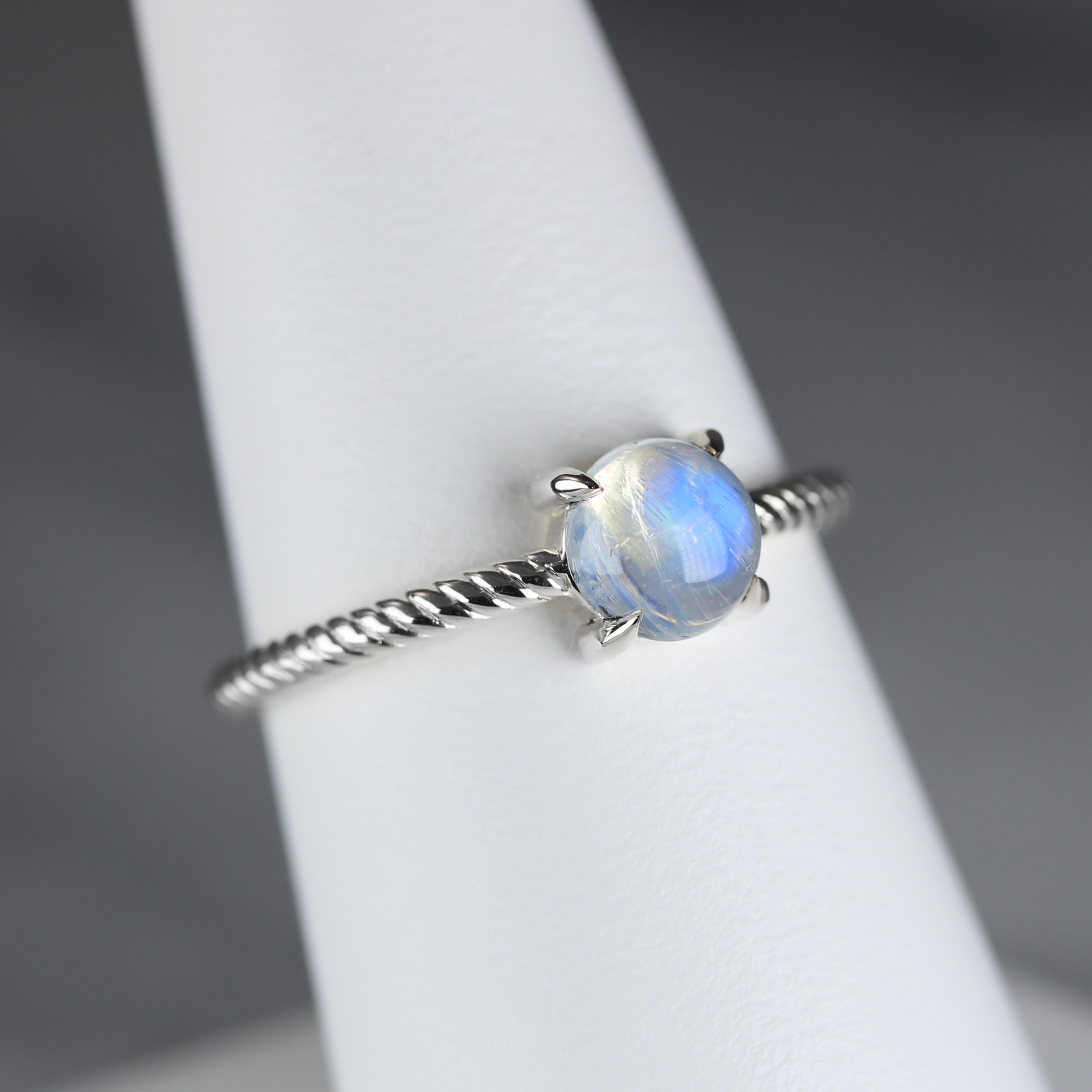 moonstone in silver rope ring angled view