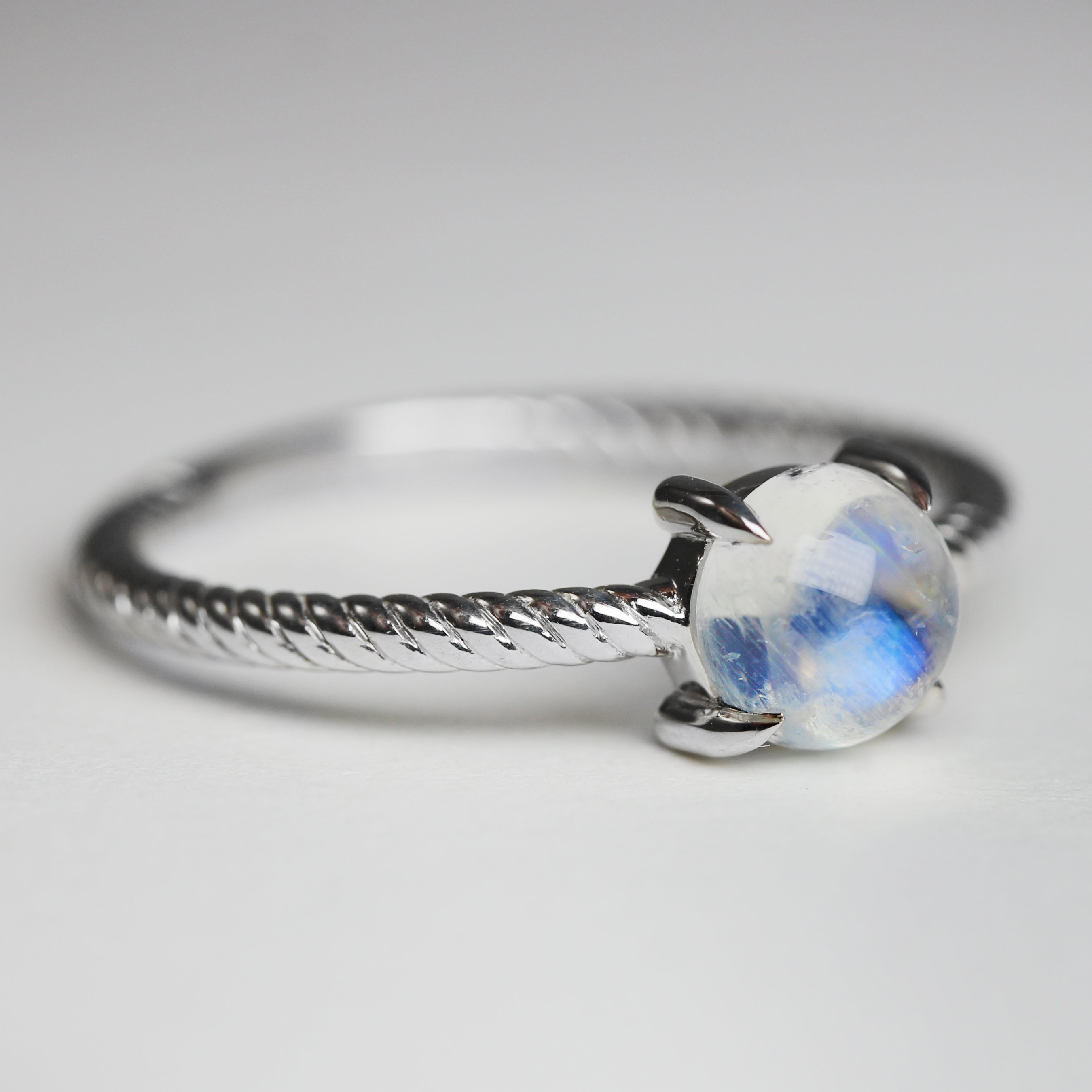 moonstone in silver rope ring angled view