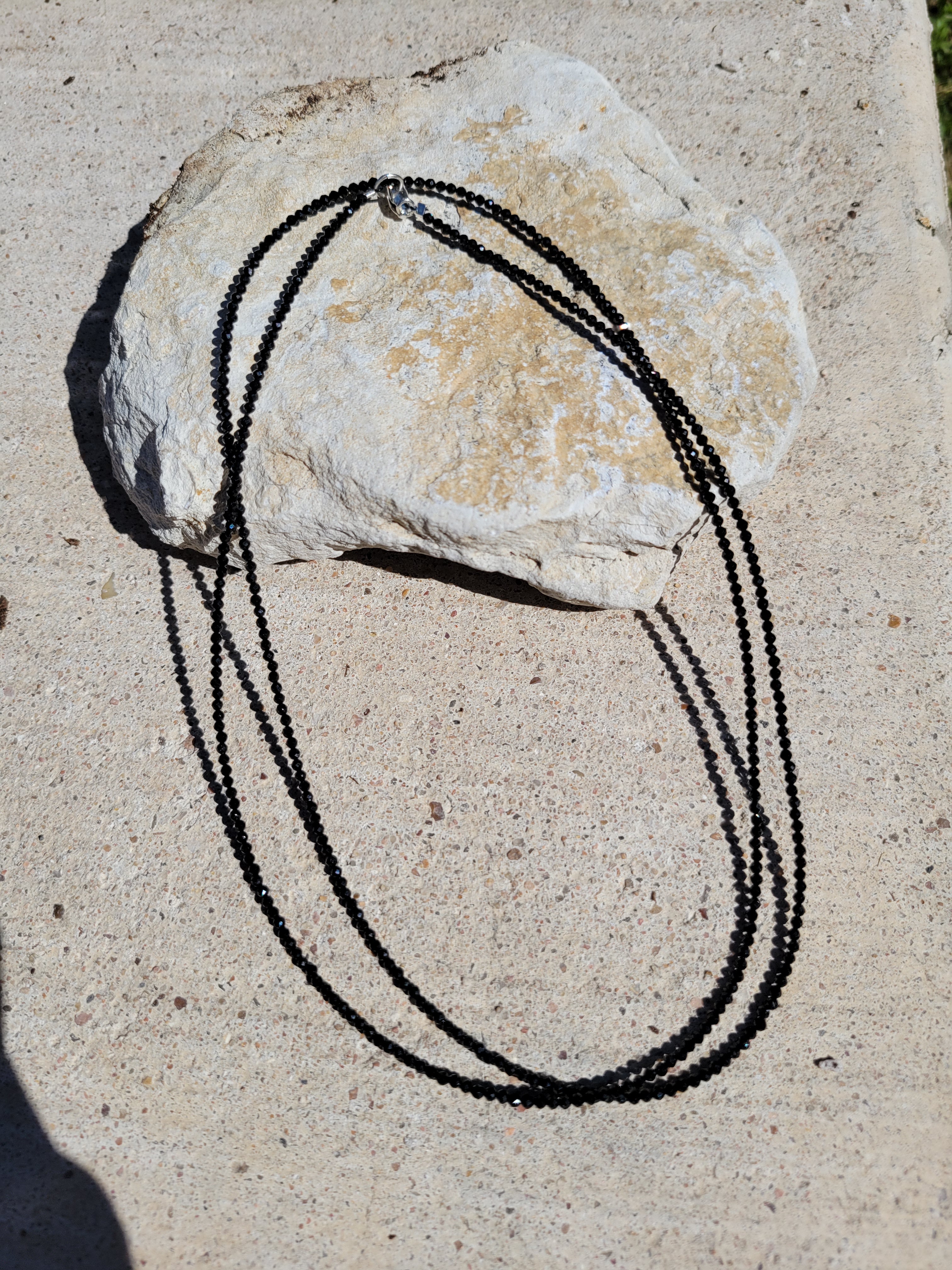 beaded necklace on rock