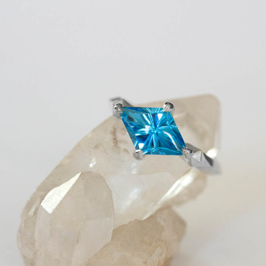 Kite Shaped Blue Topaz Pyramid Ring on crystal
