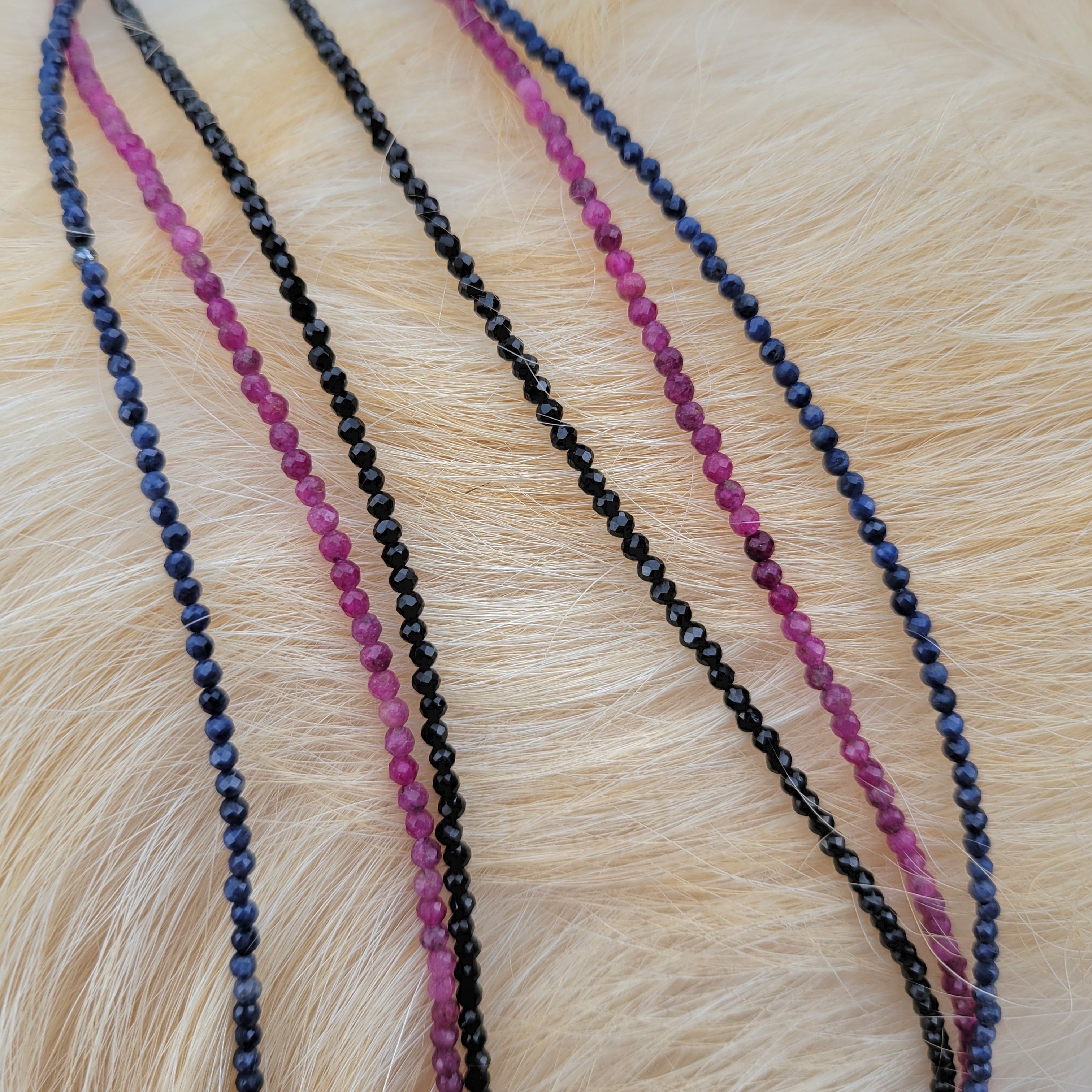 faceted gemstone beaded necklaces on fur